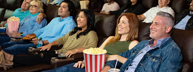 Inside Crowne Pointe Theatre — luxury recliners and modern screens